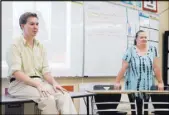  ?? Marcus Villagran Las Vegas Review-Journal ?? Victor Romero, left, site facilitato­r for the Rebel Academy, leads a history lesson for middle school students as Heidi Guy observes.