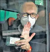  ?? REUTERS ?? Peter Ben Embarek, a member of the WHO’s probe team, waves from a bus while leaving the Wuhan Tianhe Internatio­nal Airport in China on Thursday.