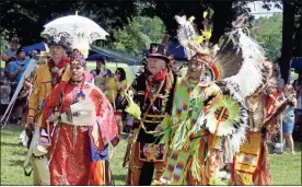  ??  ?? Head Dancers Nicole Williams, left, and Robin Jumper lead the Grand Entry dance Saturday at the Running Water Powwow Cherokee Homecoming and Ripe Corn Festival.