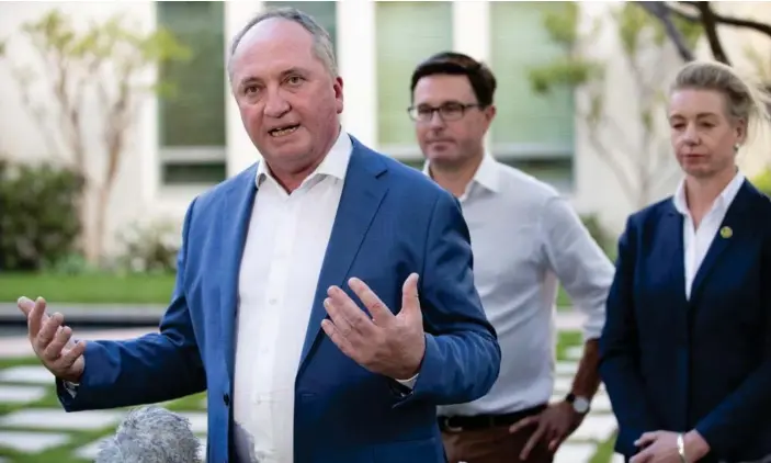  ?? Photograph: Mike Bowers/The ?? Barnaby Joyce talks to the media with David Littleprou­d and Bridget McKenzie about the National party’s in-principle decision to support a net-zero emissions target by 2050 after Sunday’s meeting.