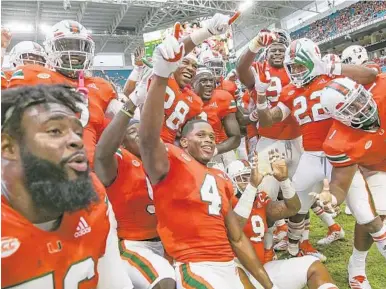  ?? AL DIAZ/MIAMI HERALD ?? Miami players celebrate during a 24-3 victory over Pittsburgh at Hard Rock Stadium last season. UM will play in Florida nine times during the 2019 regular season with six home games and road trips to Orlando, Tallahasse­e and Marlins Park in Miami.