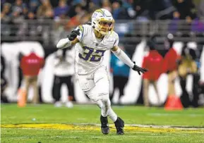  ?? GARY MCCULLOUGH AP ?? Chargers’ Alohi Gilman, in action during a wild-card playoff game against the Jaguars last season, is expected to start at safety this season alongside Derwin James.