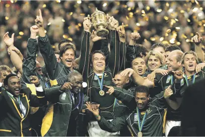  ??  ?? THREE-PEAT? Springbok centre Hennie le Roux, right, lifts skipper Francois Pienaar on his shoulders after they beat New Zealand in extra-time to win the Webb Ellis trophy for the first time in 1995. The Springboks celebrate their second triumph 12 years later under the leadership of John Smit when they beat England in the final in Paris. Can the Boks win for a third time in Yokohama, Japan today?
Pictures: Gallo Images