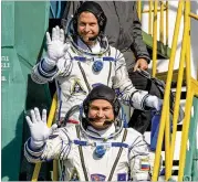  ?? GETTY IMAGES ?? Expedition 57 Flight Engineer Nick Hague of NASA (top) and Flight Engineer Alexey Ovchinin of Roscosmos wave farewell prior to boarding the Soyuz MS-10 spacecraft for launch last Thursday in Kazakhstan.