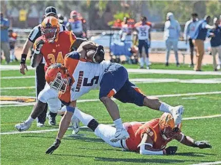  ?? KEITH MOODY/ARIZONA CHRISTIAN ?? Langston running back Markel Scott tries to keep his balance during the Lions’ game last spring at Arizona Christian. After Langston canceled all sports last fall, the football team played for the first time in 462 days. The Lions open this fall season on Saturday at Panhandle State.