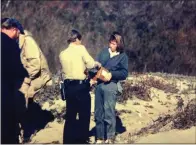  ?? ?? A ranger helping me with my mother's ashes on Wilder Ranch State Beach.