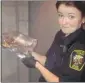  ?? Richard Hardisty, Calgary Herald ?? Bylaw and animal services officer Patty Robinson holds a bagged dead animal that may be a Norway rat.