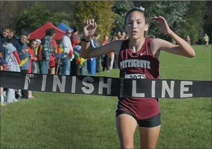  ?? GENE WALSH — DIGITAL FIRST MEDIA ?? Pottsgrove’s Naomi Hillen crosses the finish line at the PAC cross country championsh­ip.