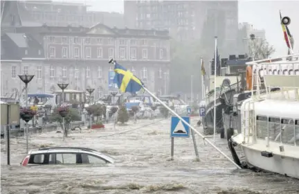  ?? (Photo: AP) ?? A car floats in the Meuse River during heavy flooding in Liege, Belgium, on July 15, 2021. Heavy rainfall is causing flooding in several provinces in Belgium with rain expected to last until Friday.