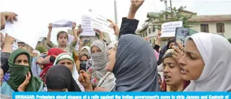  ??  ?? SRINAGAR: Protesters shout slogans at a rally against the Indian government’s move to strip Jammu and Kashmir of its autonomy and impose a communicat­ions blackout in Srinagar. — AFP