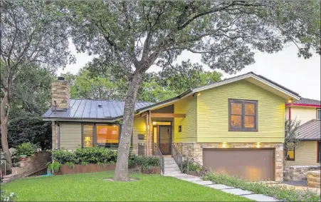  ?? TRE DUNHAM ?? Susan Terrell and Don Brode redid their 1956 home in the style of the 1950s but with modern updates. CG&S Design-Build did the redesign. The house will be on the Austin Chapter of the National Associatio­n of the Remodeling Industry Tour of Remodeled...