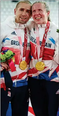  ??  ?? DOUBLE JOY: Neil and Lora Fachie with their gold medals