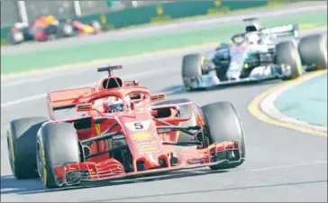  ?? WILLIAM WEST/AFP ?? Ferrari’s Sebastian Vettel leads Mercedes’ Lewis Hamilton during the Australian Grand Prix in Melbourne on March 25.