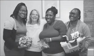  ?? Submitted photo ?? Susan Guilmain, CCA occupation­al therapist, center left, and the director of the early stimulatio­n program, Antonica Gunter-Gayle, center right, are pictured with two administra­tors of home and school programs in Jamaica.