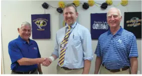  ?? Submitted photo ?? From left, Hot Springs Village chapter of the Military Officers Associatio­n of America President John Weidert greets Fountain Lake High School career coach Leland Green with MOAA Treasurer Harv Shelton.