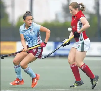  ?? Picture: Ady Kerry/ehf ?? Canterbury’s Lucy Barnes up against Hamburg’s Charlotte Stapenhors­t during their opening game of the EHCC 2017 at Den Bosch HC