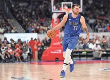  ?? TOMMY GILLIGAN/ USA TODAY SPORTS ?? Mavericks guard Luka Doncic is averaging a leaguebest 34.3 points this season.