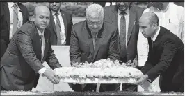  ??  ?? Palestine President Mahmud Abbas pays tribute to MahatamaGa­ndhi at his Rajghat Memorial in New Delhi on Tuesday. Abbas is on a four days state visit to India