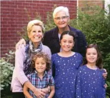  ??  ?? Premier Kathleen Wynne, her partner, Jane Rounthwait­e and their grandkids.