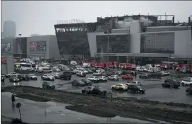  ?? ALEXANDER ZEMLIANICH­ENKO – THE ASSOCIATED PRESS ?? The burnt Crocus City Hall appears after an attack, on the western edge of Moscow, Russia on Saturday.