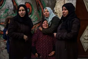  ?? FATIMA SHBAIR — THE ASSOCIATED PRESS ?? Palestinia­n women react after their home was hit by an Israeli strike in Rafah, southern Gaza Strip, on Thursday.