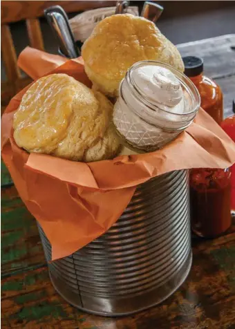  ??  ?? Buttermilk biscuits with honey butter are also part of the Texas Smokehouse package.