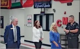  ?? Jeremy stewart ?? A message welcoming Georgia State Schools Superinten­dent Richard Woods is shown on a monitor as Woods (from left) walks through Cedartown Middle School with retired teacher Dorothy Welch and CMS Principal Tonia Little on Tuesday, May 16.