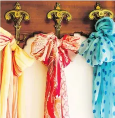  ?? GETTY IMAGES/ISTOCKPHOT­O ?? Scarves can be stored on hooks in a closet, or can make a statement, hanging from decorative hooks in a bedroom.