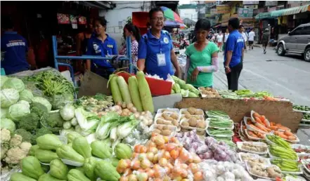  ?? AFP/VNA Photo ?? A market in Manila. Growth in the Philippine­s economy was expected to slow to 5.3 per cent this year from 7.6 per cent in 2022.