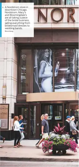  ?? Bloomberg ?? A Nordstrom store in downtown Chicago. Nordstrom, Macy’s and Bloomingda­le’s are all taking a piece of the bridal business, selling everything from bridesmaid dresses to wedding bands.