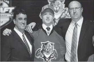  ?? GETTY IMAGES FILES ?? Mike Matheson, centre, was drafted 23rd overall by the NHL’s Florida Panthers in June.