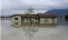  ?? Photograph: Jesse Winter/Reuters ?? A house surrounded by flood waters in Chilliwack, British Columbia.