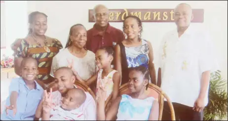  ??  ?? Family portrait: From left (back row): Daughter Dr Vivienne Mitchell-Amata, wife Stella, Dr Gladstone Mitchell, daughter Sonia an attorney in Jamaica and son-in-law Dr Andrew Amata. And in the front row are his grandchild­ren: Clemson, Raphael, Harlen,...