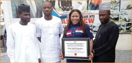  ??  ?? The First Lady Mechanic flanked by members of NAPS during the award