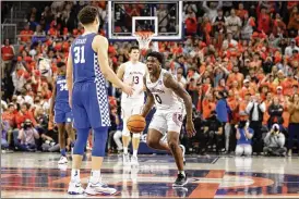  ?? BUTCH DILL / AP ?? Auburn guard K.D. Johnson reacts after being fouled in the closing seconds as the Tigers held on to defeat the visiting Kentucky Wildcats on Saturday. Johnson scored 17 points as the Tigers rallied from 10 points down.