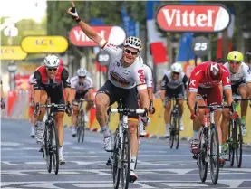  ??  ?? Andre Greipel of Germany winning yesterday’s 21st and last leg in a sprint finish Photo: AP