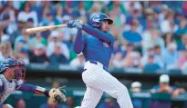  ?? ROSS D. FRANKLIN/AP ?? Cody Bellinger connects for a sacrifice fly during the first inning of a spring training game on Sunday in Mesa, Arizona.