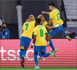  ?? (AFP) ?? Brazil’s Lucas Paqueta (R) celebrates with teammates after scoring against Chile during their Conmebol 2021 Copa America quarter-final at the Nilton Santos Stadium in Rio de Janeiro, Brazil, on Friday.