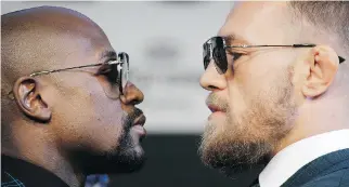  ?? JOHN LOCHER/THE ASSOCIATED PRESS ?? The boxing match between Floyd Mayweather Jr., left, and Conor McGregor Saturday in Las Vegas is going to make McGregor rich enough to do whatever he wants for the rest of his life.