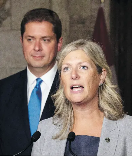  ?? ADRIAN WYLD / THE CANADIAN PRESS ?? ‘I look forward to working with my Conservati­ve colleagues who are unafraid to do the real work,’ said former Liberal MP Leona Alleslev on Monday, with Conservati­ve leader Andrew Scheer at her side.