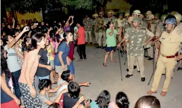  ?? — PTI ?? Students of the Banaras Hindu University and the police in a standoff in Varanasi late on Saturday night.