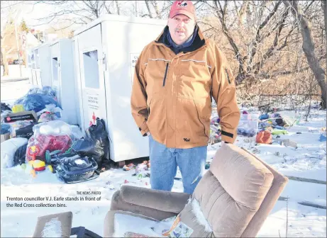  ?? THE NEWS PHOTO ?? Trenton councillor V.J. Earle stands in front of the Red Cross collection bins.