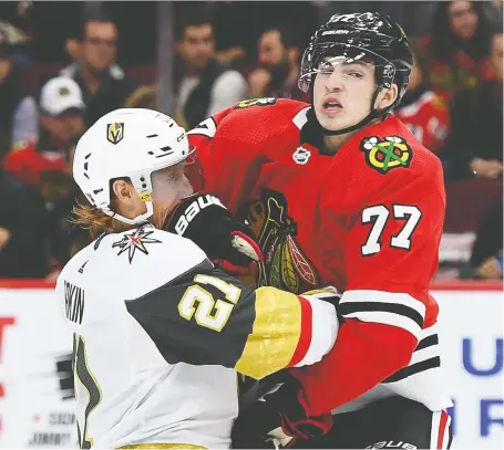  ?? STACY REVERE/GETTY IMAGES ?? Blackhawks centre Kirby Dach, right, pictured colliding with Vegas’s Cody Eakin earlier this month, has notched a goal and an assist in six games with Chicago this season. The third overall choice of the 2019 draft signed an entry-level contract that now kicks in.