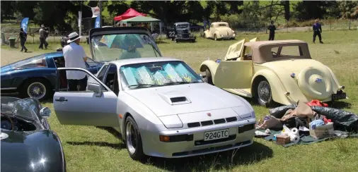  ??  ?? How’s this for a paddock scene? Replica Jaguar C-type, Porsche 924 Carrera GTC, Aston Martin and Iso Grifo and in the background, a pair of Ford V8s