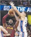  ??  ?? 76ers phenom Ben Simmons guarding LeBron James.