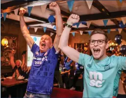  ?? ?? ABOVE: Ivan and Andrew Jackson, Ipswich fans cheering on their team in The Manor House Hotel in Enniskille­n.