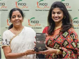  ?? — PTI ?? Union defence minister Nirmala Sitharaman being felicitate­d by FLO President Pinky Reddy at an interactiv­e sesion on “Stories That Matter - Journey of India's First FullTime Defence Minister” in New Delhi on Monday.