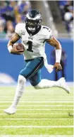  ?? RICK OSENTOSKI/AP ?? Eagles quarterbac­k Jalen Hurtsrushe­s in the second half Sunday against the Detroit Lions.