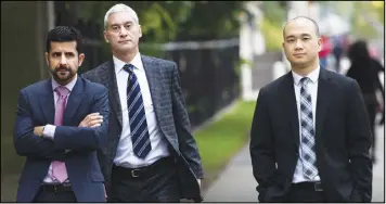  ?? CP PHOTO ?? Daniel Westreich, left, Associate Vice-President, Senior Corporate Counsel at Sears Inc., Philip Mohtadi, centre, General Counsel and Corporate Secretary at Sears Inc., and Billy Wong, right, Chief Financial Officer at Sears Inc., arrive at the Ontario...