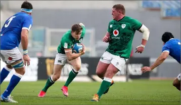  ??  ?? Tadhg Furlong stays out of Garry Ringrose’s way as his team-mate makes a break in Rome.